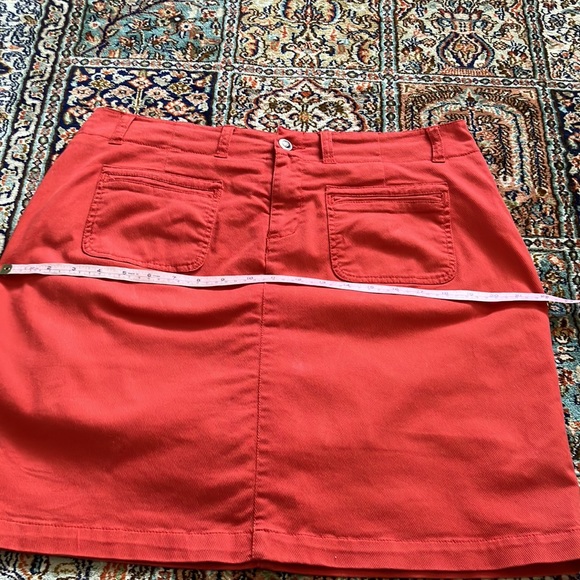 Light orange jean skirt with front and back pockets w/attached stretch shorts. - Picture 10 of 12